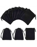 Bolsa de regalo. Terciopelo. Color negro. Cierre con cordón. 90x70 milímetros. 4 unidades. Bolsa de regalo. Terciopelo. Color negro. Cierre con cordón. 90x70 milímetros. 4 unidades.