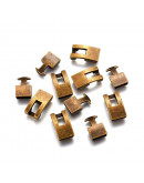 Cierre Snap Lock. Bronce. Color bronce antiguo. 22x12x6 milímetros. 3x10 mm perforación. 2 sets.