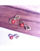 Infinito+corazón+flor. Aleación+Zirconia+Esmalte. Baño 18KGold. 22x12x2 mm. 1,2 mm perforación. 1 ud Infinito+corazón+flor. Aleación+Zirconia+Esmalte. Baño 18KGold. 22x12x2 mm. 1,2 mm perforación. 1 ud