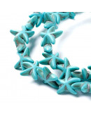 Turquesa sintética. Estrellas de mar. Color azul. 14x14 mm. 1 mm perforación. 35 uds hilo (aprox.).