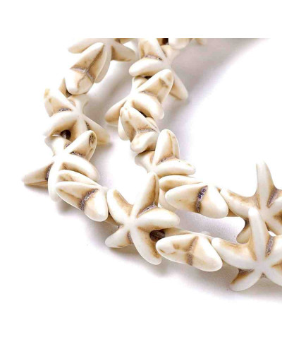 Turquesa sintética. Estrellas de mar. Color blanco. 14x14 mm. 1 mm perforación. 35 uds hilo aprox.