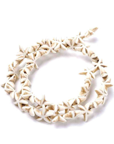 Turquesa sintética. Estrellas de mar. Color blanco. 14x14 mm. 1 mm perforación. 35 uds hilo aprox.