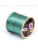 Cordón de nylon. Acabado Satén. 1 mm grosor. Color TURQUOISE. 80 metros cono. Cordón de nylon. Acabado Satén. 1 mm grosor. Color TURQUOISE. 80 metros cono.