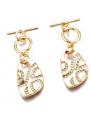 Cierre de barra. Forma irregular. Aleación+Zirconia. Baño 18KGold. 34 milímetros. Barra 13 mm. 1 set