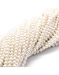 Concha de mar. Esfera color perla. 4 milímetros. 1 mm perforación. 95 uds hilo (aprox).