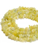 Chips 5-8 milímetros. Jade Limón. 0,8 mm perforación. 250 unidades hilo aproximado. 1 hilo.