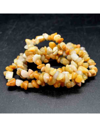 Chips 5-8 milímetros. Jade Yellow. 0,8 mm perforación. 250 unidades hilo aproximado. 1 hilo.