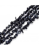 Chips 5-8 milímetros. Obsidiana. 0,8 mm perforación. 250 unidades hilo aproximado. 1 hilo.