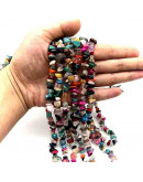 Chips 5-8 milímetros. Varias. 0,8 mm perforación. 250 unidades hilo aproximado. 1 hilo.