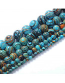 Malaquita sintética. Tonos azules. 10 mm diámetro. 1 mm perforación. 35 uds hilo aprox. 1 hilo.