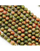 Unakite. 06 milímetros diámetro. 1 mm perforación. 60 unidades hilo aproximado. 1 hilo.