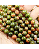 Unakite. 06 milímetros diámetro. 1 mm perforación. 60 unidades hilo aproximado. 1 hilo.