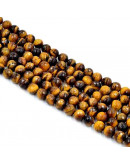 Ojo de Tigre. Faceteado. 12 milímetros diámetro. 1 mm perforación. 30 unidades hilo aprox. 1 hilo. Ojo de Tigre. Faceteado. 12 milímetros diámetro. 1 mm perforación. 30 unidades hilo aprox. 1 hilo.