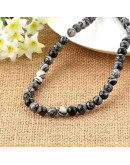 Piedra natural. Líneas negras. 06 mm diámetro. 1 mm perforación. 60 unidades hilo aprox. 1 hilo.