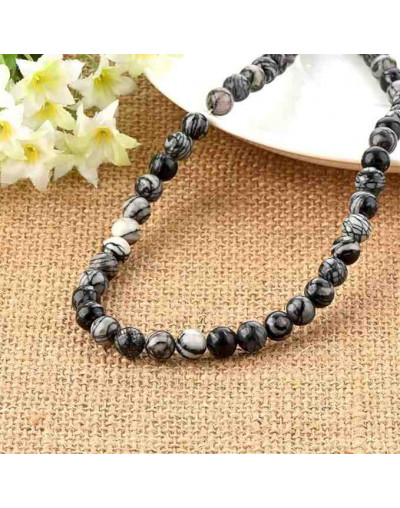 Piedra natural. Líneas negras. 08 mm diámetro. 1 mm perforación. 45 unidades hilo aprox. 1 hilo.