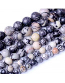 Piedra natural. Líneas negras. 08 mm diámetro. 1 mm perforación. 45 unidades hilo aprox. 1 hilo.