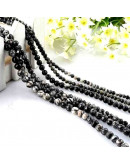 Piedra natural. Líneas negras. 08 mm diámetro. 1 mm perforación. 45 unidades hilo aprox. 1 hilo.