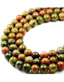 Unakite. 12 milímetros diámetro. 1 mm perforación. 30 unidades hilo aproximado. 1 hilo.