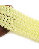 Piedra sintética. Fluorescente. YELLOW. 06 mm diámetro. 1 mm perforación. 60 uds hilo aprox. 1 hilo.