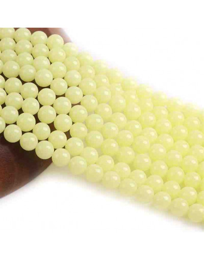 Piedra sintética. Fluorescente. YELLOW. 06 mm diámetro. 1 mm perforación. 60 uds hilo aprox. 1 hilo.