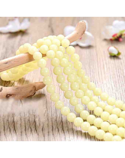 Piedra sintética. Fluorescente. YELLOW. 06 mm diámetro. 1 mm perforación. 60 uds hilo aprox. 1 hilo.