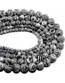 Malaquita sintética. Black. 10 mm diámetro. 1 mm perforación. 35 unidades hilo aprox. 1 hilo.