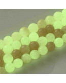 Piedra sintética. Fluorescente. SALMON. 06 mm diámetro. 1 mm perforación. 60 uds hilo aprox. 1 hilo.