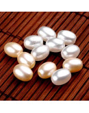 Ovalo. Imitación perla. Color White. 9x7 milímetros. 2 mm perforación.  100 unidades aproximado.