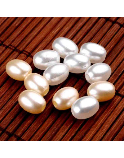 Ovalo. Imitación perla. Color White. 9x7 milímetros. 2 mm perforación.  100 unidades aproximado.