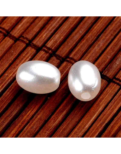 Ovalo. Imitación perla. Color White. 9x7 milímetros. 2 mm perforación.  100 unidades aproximado.