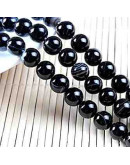 Agata Banded. Color negro. 10 mm diámetro. 1,2 mm perforación 35 uds hilo (aproximado).