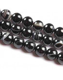 Agata Banded. Color negro. 06 mm diámetro. 1 mm perforación. 60 uds hilo (aproximado).