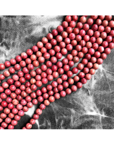 Piedra natural. Líneas rojas. 06 milímetros diámetro. 1 mm perforación. 60 uds hilo aprox. 1 hilo.