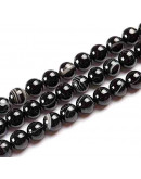 Agata Banded. Color negro. 08 milímetros diámetro. 1 mm perforación. 60 uds hilo aprox. 1 hilo.