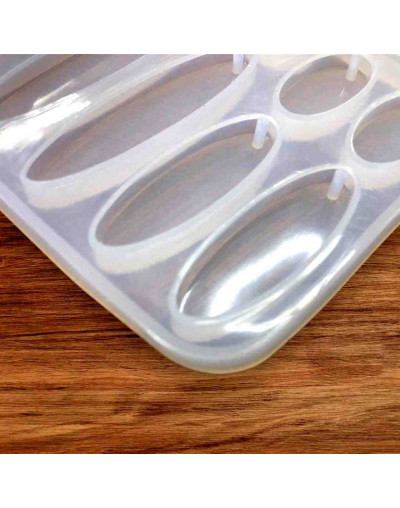 Molde de silicona. Para resina. Formas aretes. 4 formas. 75x70 mm.  2 mm perforación. 1 unidad.