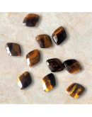 Ojo de Tigre. Rombo Faceteado. 10x12x5 milímetros. 1 mm perforación. 1 unidad. Ojo de Tigre. Rombo Faceteado. 10x12x5 milímetros. 1 mm perforación. 1 unidad.