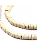 Discos. Color beige. 4 mm diámetro. 1 mm grosor. 380~400 uds hilo. 10 hilos.