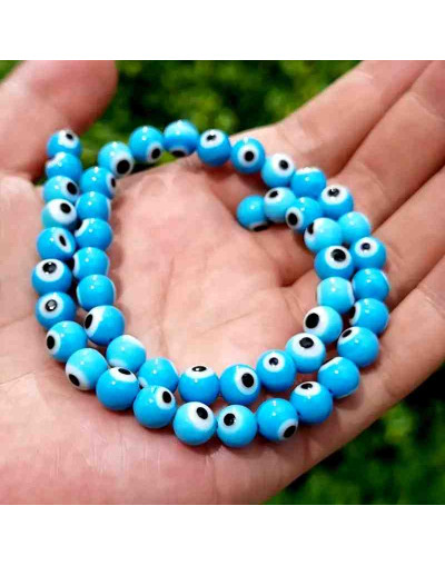 Ojo turco. Esfera. Color Celeste. 06 mm diámetro. 1 mm perforación. 60 uds hilo aprox. 1 hilo.