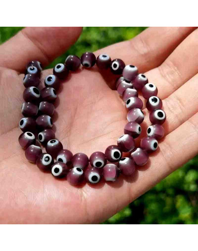 Ojo turco. Esfera. Color Morado. 04 mm diámetro. 1 mm perforación. 90 uds hilo aprox. 1 hilo.