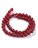 Carnelian. 06 milímetros diámetro. 1 mm perforación. 60 uds hilo aprox. 1 hilo.