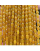 Calcedonia Teñida. Amarillo. Barril. 9x6 mm. 1 mm perforación. 40 uds hilo aprox. 1 hilo.