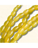 Calcedonia Teñida. Amarillo. Barril. 9x6 mm. 1 mm perforación. 40 uds hilo aprox. 1 hilo.