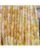 Calcedonia Teñida. Amarillo Multicolor. Barril. 9x6 mm. 1 mm perforación. 40 uds hilo aprox. 1 hilo.