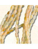 Calcedonia Teñida. Amarillo Multicolor. Barril. 9x6 mm. 1 mm perforación. 40 uds hilo aprox. 1 hilo.