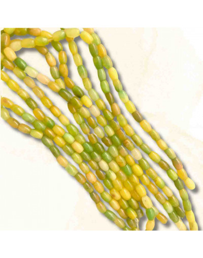 Calcedonia Teñida. Amarillo-Verde Mult. Barril. 9x6 mm. 1 mm perforación. 40 uds hilo aprox. 1 hilo.