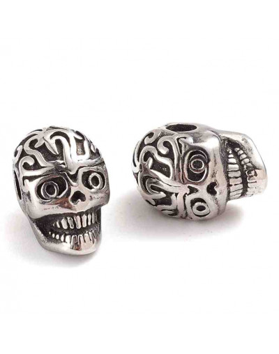 Calavera (3). Acero inoxidable. Color platedo. 11,2x7,8,5x9 mm. 2,4 mm perforación. 1 unidad.
