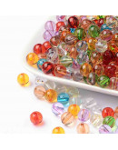 Esfera transparente. Varios colores. 8 mm diámetro. 1,5 mm perforación. 50 unidades.