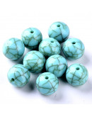 Turquesa (imitación). Esfera. 10x9,5 milímetros. 1,5 mm perforación. 30 unidades aprox.