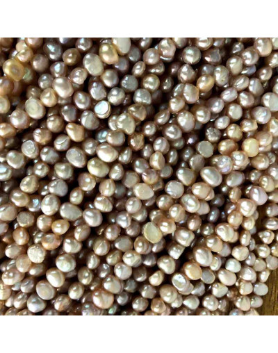 Perla natural de río. Forma irregular. Floral Tornasol. 4~6x4~6 mm. 0,5 mm perforación. 60 uds hilo.