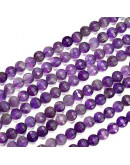 Amatista. Moneda faceteada. 6x4 milímetros. 1 mm perforación. 55 uds hilo aprox. 1 hilo.